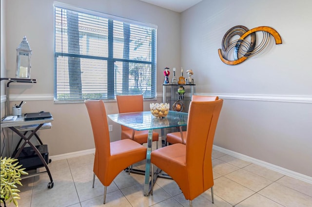 dining room with baseboards and light tile patterned floors