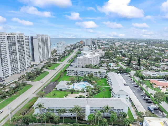 drone / aerial view featuring a water view and a city view