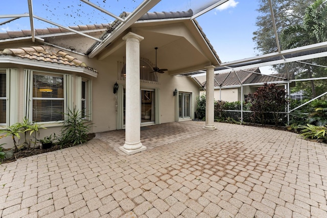 view of patio / terrace with a lanai and ceiling fan