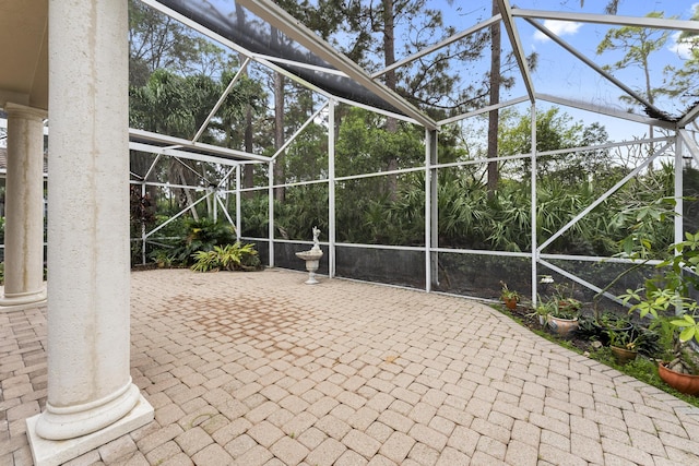 view of patio / terrace featuring glass enclosure