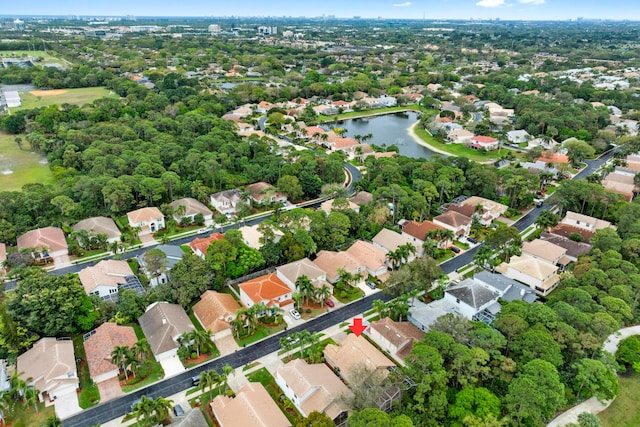 bird's eye view with a residential view and a water view