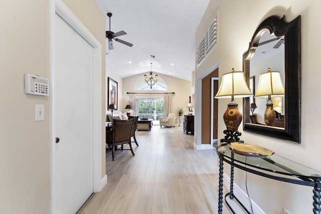 hall with light wood-type flooring, baseboards, vaulted ceiling, and recessed lighting