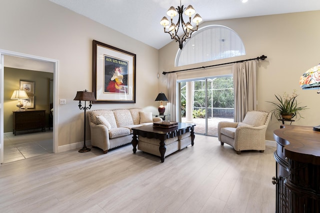 living room with light wood finished floors, baseboards, a chandelier, and high vaulted ceiling