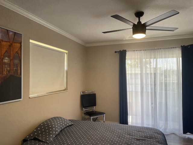 bedroom with a ceiling fan and crown molding