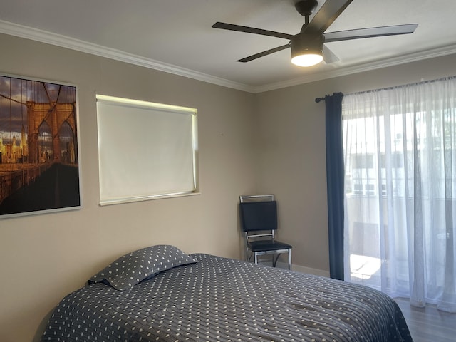 bedroom with a ceiling fan and crown molding