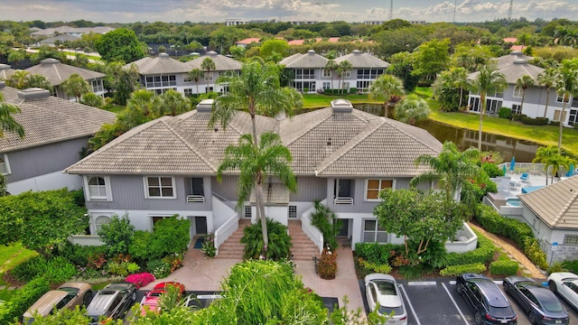 birds eye view of property featuring a residential view and a water view