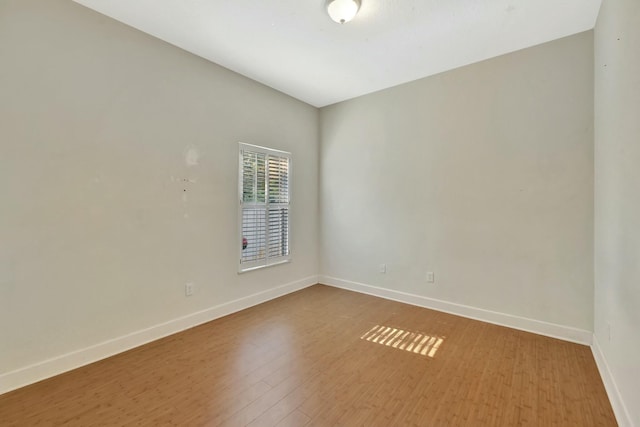 961 SW Haas Ave, Port Saint Lucie, FL 34953 - unfurnished room featuring wood finished floors and baseboards