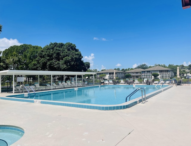 14 Lake Vista Trl Unit 102, Port Saint Lucie, FL 34952 - community pool featuring a patio area