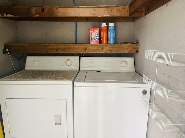14 Lake Vista Trl Unit 102, Port Saint Lucie, FL 34952 - laundry area featuring washer and dryer and concrete block wall