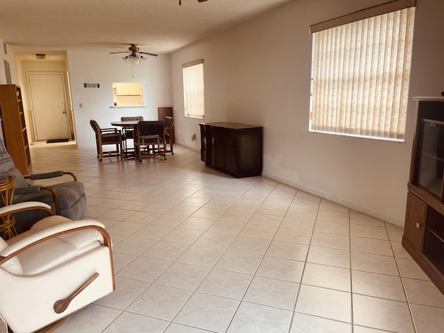 14 Lake Vista Trl Unit 102, Port Saint Lucie, FL 34952 - living area featuring a ceiling fan and light tile patterned flooring