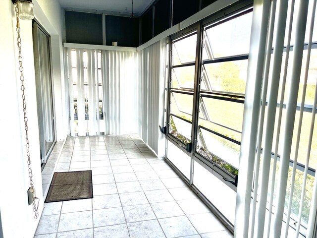 unfurnished sunroom featuring a wealth of natural light