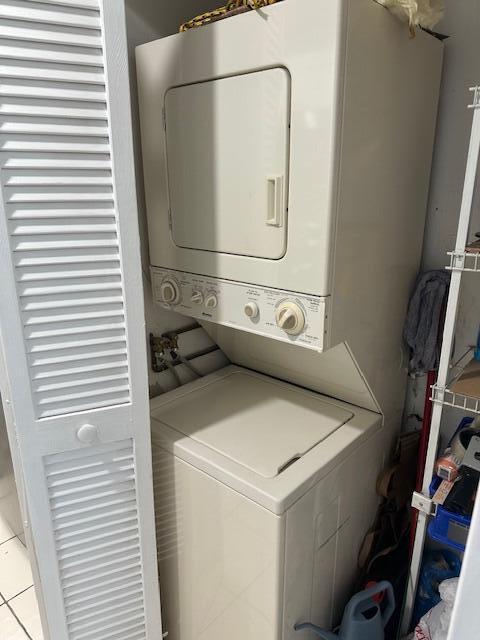 laundry area featuring laundry area and stacked washer and clothes dryer