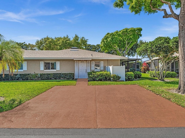 ranch-style home with a front lawn and stucco siding