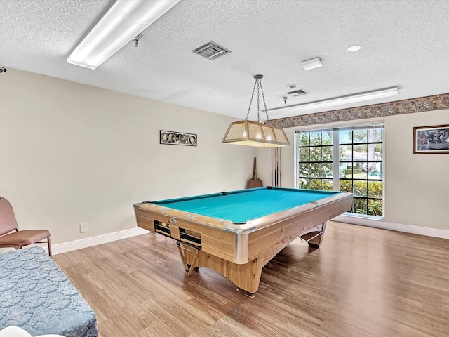 game room with light wood-style floors, baseboards, visible vents, and pool table