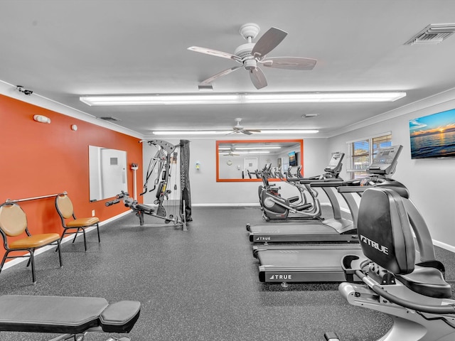 exercise room featuring baseboards, visible vents, ceiling fan, and crown molding