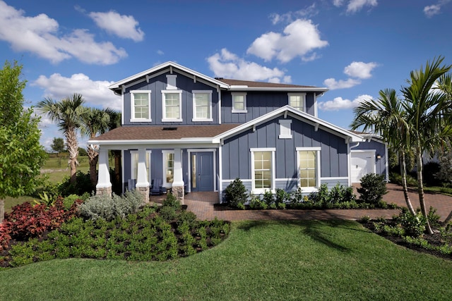 view of front of house featuring board and batten siding and a front yard