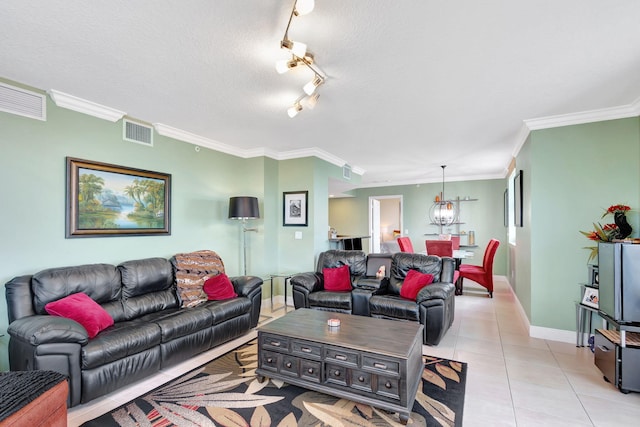 living room with visible vents, a textured ceiling, baseboards, and light tile patterned flooring