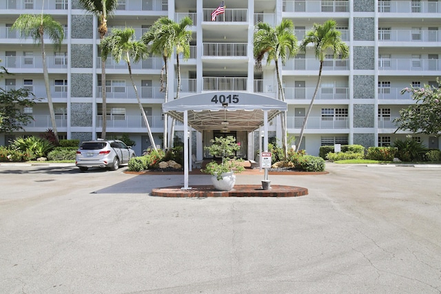 view of building exterior with uncovered parking