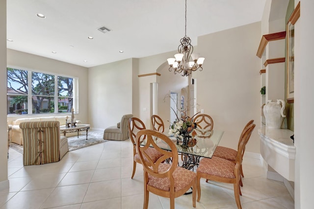 dining space with light tile patterned floors, visible vents, a notable chandelier, and recessed lighting