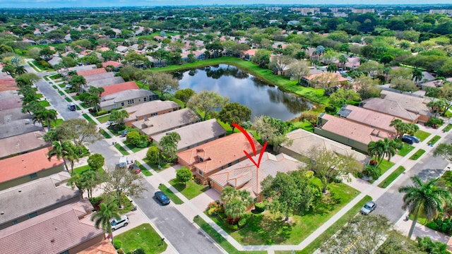 bird's eye view with a water view and a residential view