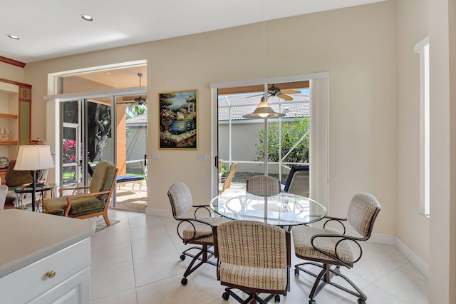 dining room featuring ceiling fan, recessed lighting, light tile patterned flooring, and baseboards