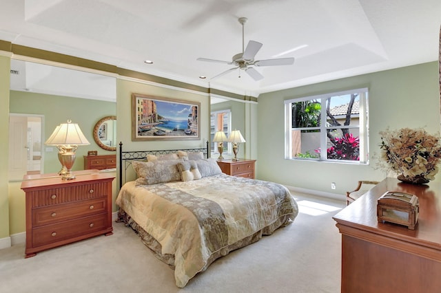 bedroom featuring baseboards, ceiling fan, visible vents, and light colored carpet