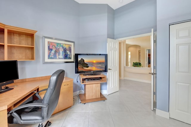 office with light tile patterned flooring and baseboards