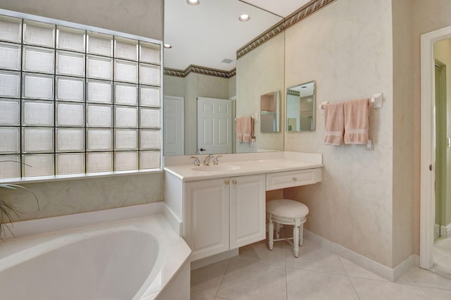 full bath featuring a garden tub, recessed lighting, vanity, baseboards, and tile patterned floors