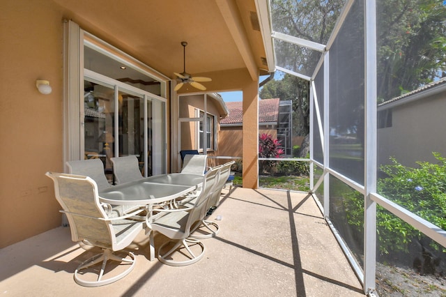 sunroom / solarium with ceiling fan