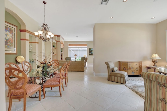 dining room featuring light tile patterned floors, recessed lighting, visible vents, and an inviting chandelier