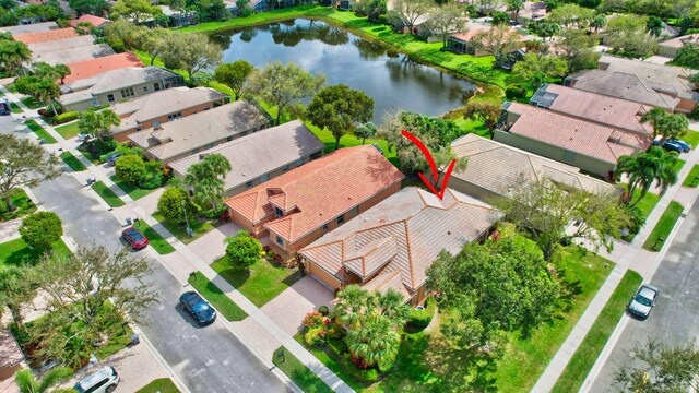 aerial view with a water view and a residential view