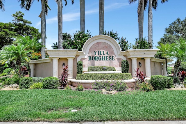 community / neighborhood sign featuring a lawn