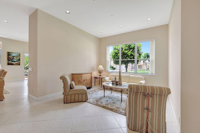 living area with light tile patterned floors, recessed lighting, and baseboards