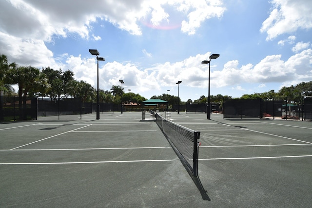 view of sport court featuring fence