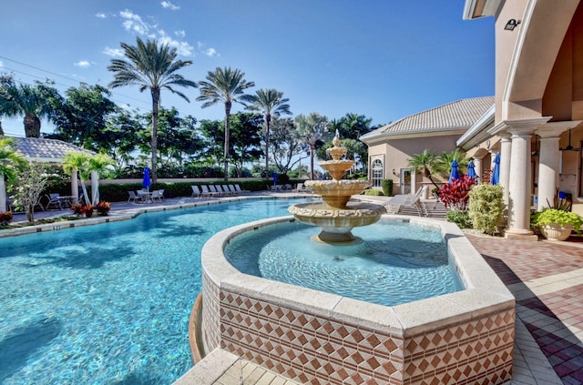 view of swimming pool featuring a patio area