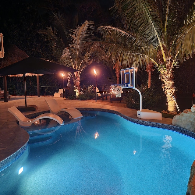 pool with a patio