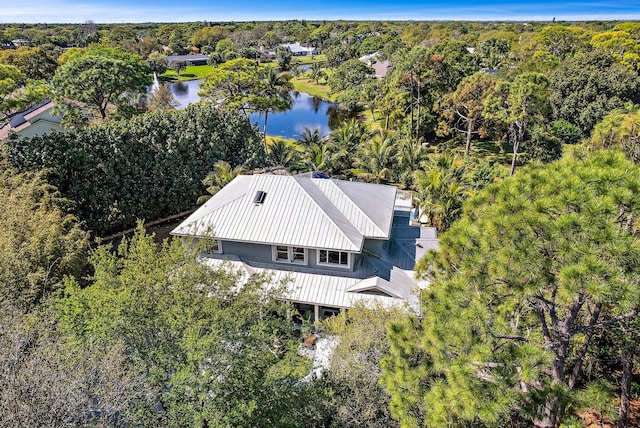 aerial view featuring a water view and a forest view