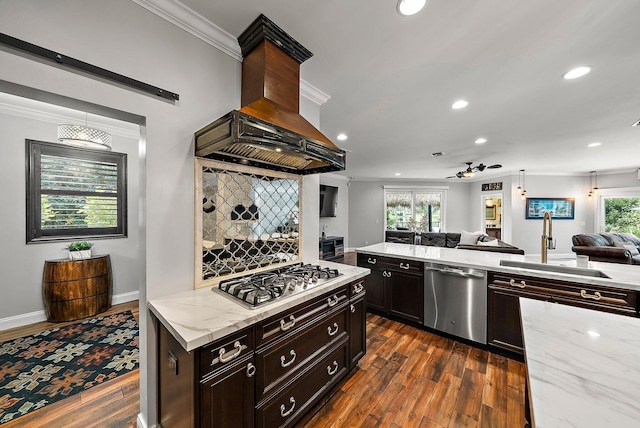 kitchen with dark wood-style flooring, appliances with stainless steel finishes, open floor plan, a sink, and island range hood