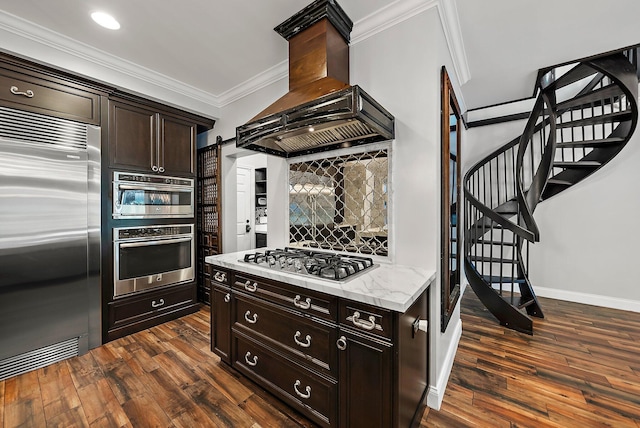 kitchen with island range hood, stainless steel appliances, dark wood-style floors, tasteful backsplash, and crown molding