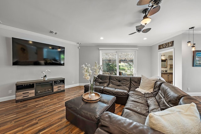 living room featuring baseboards, dark wood finished floors, visible vents, and crown molding