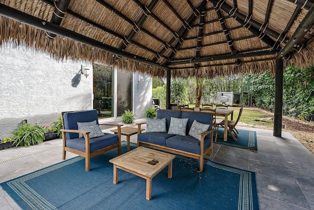 view of patio featuring an outdoor living space and outdoor dining space