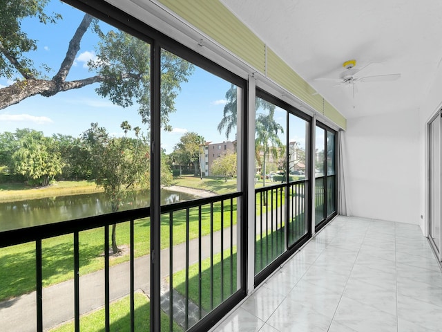 unfurnished sunroom with a water view