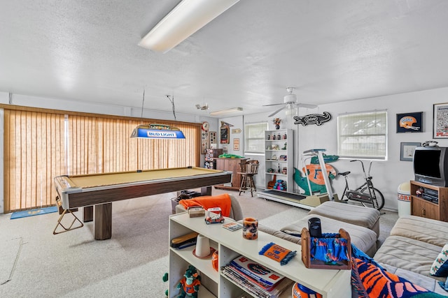 recreation room with carpet floors, billiards, and a textured ceiling