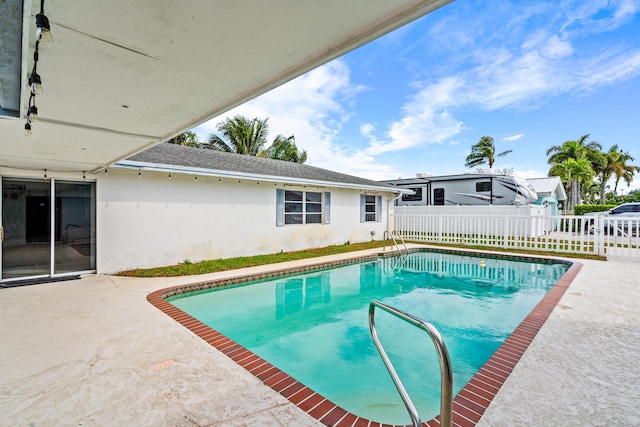 view of pool featuring a patio, fence, and a fenced in pool