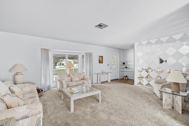 carpeted living area with visible vents