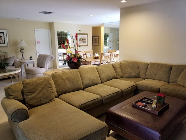 living room featuring visible vents and recessed lighting