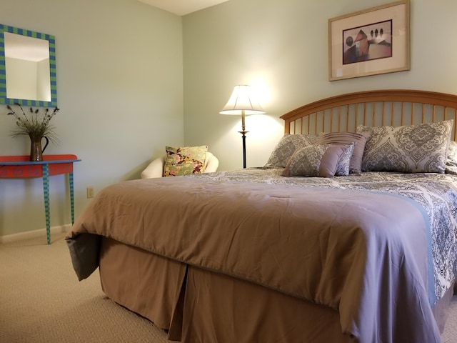 carpeted bedroom with baseboards