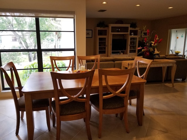 dining area featuring recessed lighting