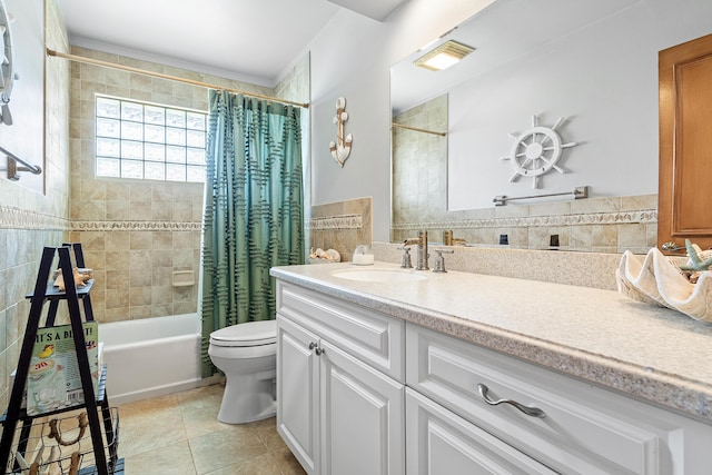 full bathroom with shower / bath combo with shower curtain, toilet, tile patterned flooring, and vanity
