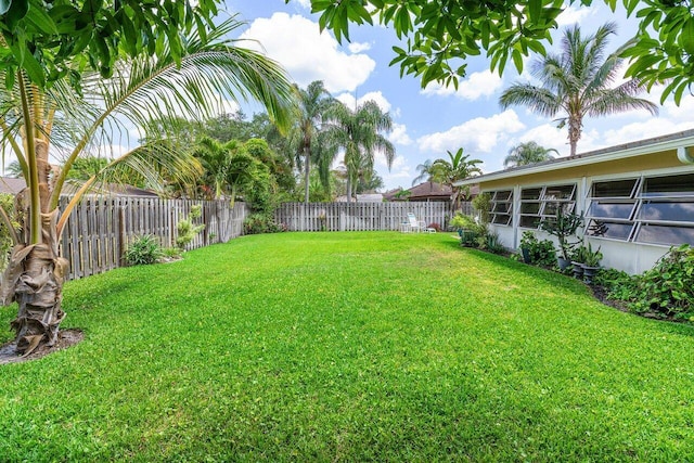 view of yard with a fenced backyard